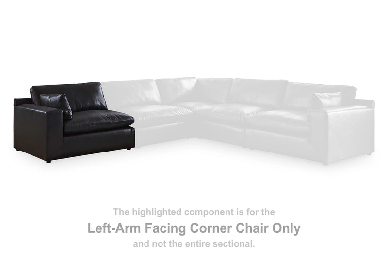 Ashley Furniture Emilia sectional sofa in a spacious L-shaped design with plush seating and neutral upholstery