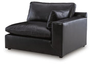 Ashley Furniture Emilia sectional sofa in a neutral fabric with chaise seating and plush cushions
