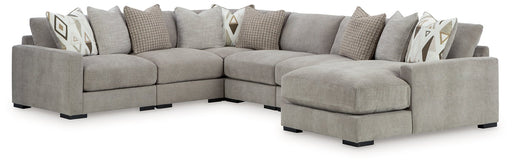 Ashley Furniture Aslan sectional with chaise, featuring plush upholstery and modern design, shown in a stylish living room setting.