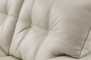 Ashley Furniture Santorine living room set, including sofa and loveseat with tufted upholstery, in a contemporary living room setting.