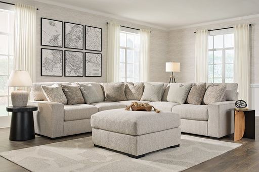 Ashley Furniture Ballyton upholstery living room set with sofa, loveseat, and chair in neutral fabric, arranged in a cozy living space.