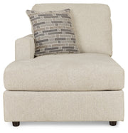 Ashley Furniture Edenfield 3-piece sectional with chaise, featuring plush cushions and modern design in a cozy living room setup.