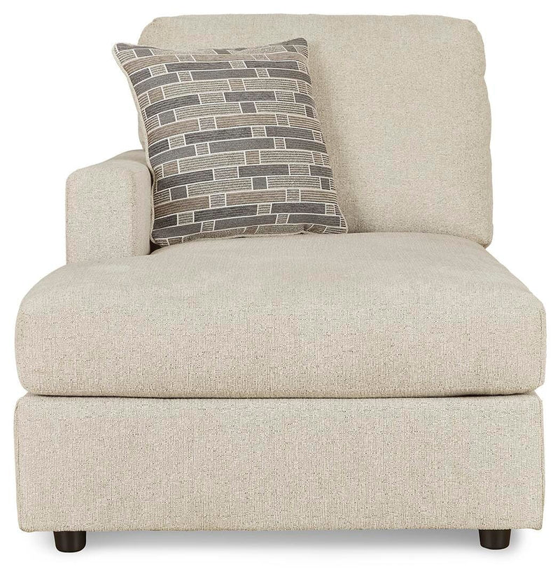 Ashley Furniture Edenfield 3-piece sectional with chaise, featuring plush cushions and modern design in a cozy living room setup.