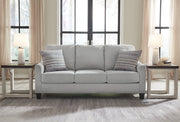 Ashley Furniture Adlai Sofa Sleeper with plush fabric and modern design, featuring a fold-out bed in a cozy living room setting.