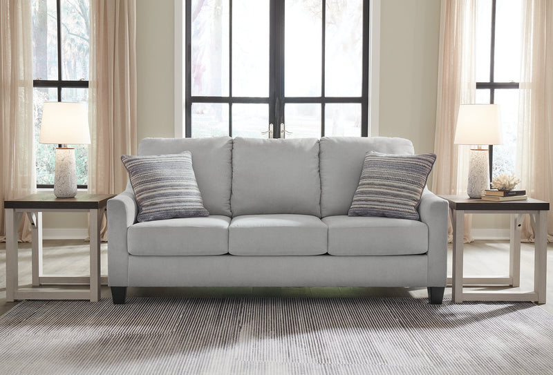 Ashley Furniture Adlai Sofa Sleeper with plush fabric and modern design, featuring a fold-out bed in a cozy living room setting.