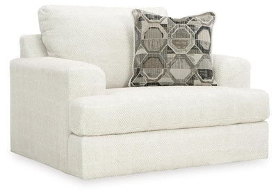 Ashley Furniture Karinne Oversized Chair with plush fabric and wide armrests, shown from an angled view.