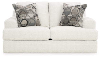 Ashley Furniture Karinne Loveseat with plush fabric and padded armrests, shown from a front head-on view.
