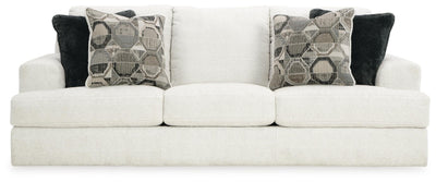 Ashley Furniture Karinne Sofa with plush beige fabric and modern design, shown from a front head-on view.