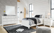 Ashley Furniture Fortman bedroom set with coordinated bed, dresser, and nightstand in warm wood finish