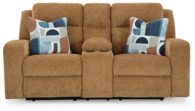 Ashley Furniture Kanlow reclining loveseat with built-in console, showcasing plush fabric and comfortable seating in a modern living room setting.