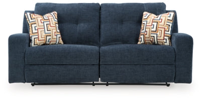 Ashley Furniture Danum reclining sofa with plush fabric and wide armrests, shown from a front head-on view.
