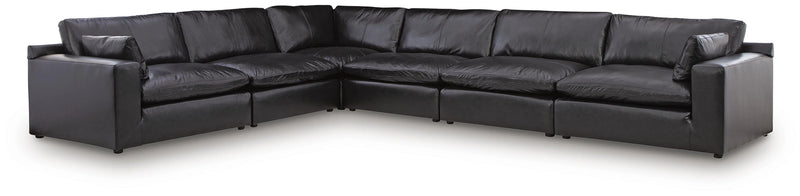 Ashley Furniture Emilia sectional sofa in a neutral fabric with chaise lounge and plush cushions