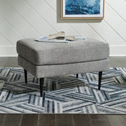 Ashley Furniture Hazela living room set with sofa, loveseat, and armchair in a modern design, shown in a cozy living space.