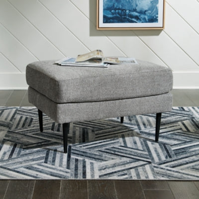 Ashley Furniture Hazela living room set with sofa, loveseat, and armchair in a modern design, shown in a cozy living space.