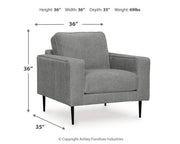Ashley Furniture Hazela living room set featuring a sofa, loveseat, and armchair with neutral upholstery and modern design.