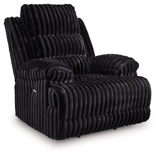 Ashley Furniture Rhine Falls power recliner in dark leather, showing the closed reclining position with plush cushioning.