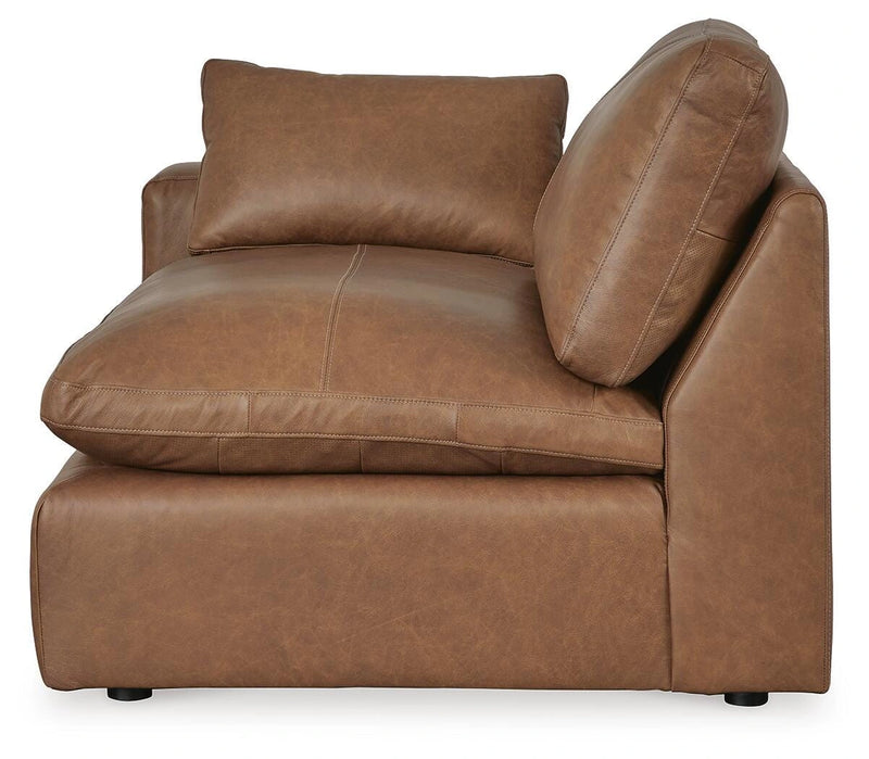 Ashley Furniture Emilia sectional sofa in a neutral fabric with plush cushions and a chaise lounge