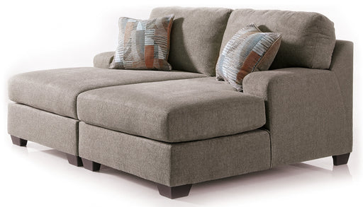 Ashley Furniture Newellen Super Chaise sectional with plush cushions and modern design, shown in a cozy living room setting.
