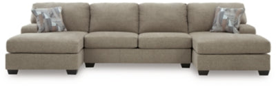 Ashley Furniture Newellen sectional with double chaise, featuring plush upholstery and modern design in a stylish living room setting.