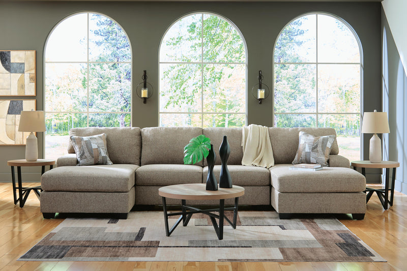 Ashley Furniture Newellen sectional with chaise, featuring plush upholstery and modern design, shown in a stylish living room setting.