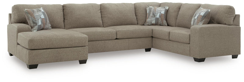 Ashley Furniture Newellen sectional with chaise, showing plush fabric upholstery and modern design in a living room setting.
