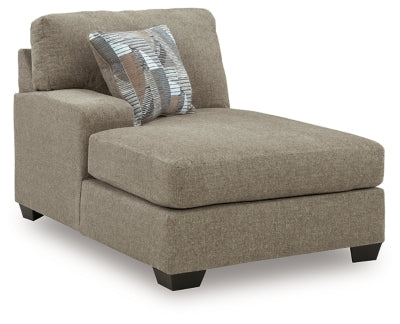 Ashley Furniture Newellen sectional with double chaise, showing a modern L-shaped sofa with plush cushions and stylish fabric upholstery.