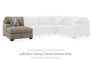 Ashley Furniture Newellen sectional with double chaise, shown in a modern living room setting, featuring plush fabric upholstery and spacious seating.
