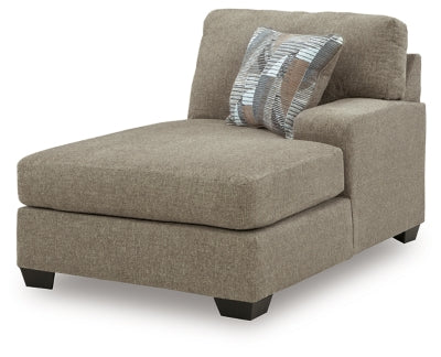 Ashley Furniture Newellen sectional with double chaise, featuring plush fabric, modern design, and ample seating in a stylish living room setting.