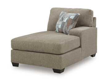 Ashley Furniture Newellen Sleeper Sectional with chaise in a modern fabric, shown from an angled view featuring the seating and chaise.