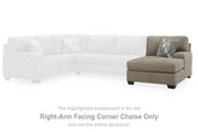 Ashley Furniture Newellen sectional with double chaise, featuring plush cushions and modern design in a neutral fabric.
