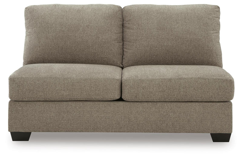 Ashley Furniture Newellen Sleeper Sectional with chaise, beige fabric, and plush cushions, shown from a head-on angle.