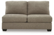 Ashley Furniture Newellen sectional with double chaise, featuring plush cushions and a contemporary design in a living room setting.