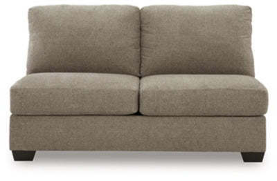 Ashley Furniture Newellen sectional with double chaise, featuring plush cushions and a contemporary design in a living room setting.