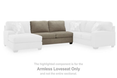Ashley Furniture Newellen sectional with double chaise, featuring plush upholstery and modern design in a stylish living room setup.