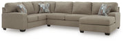 Ashley Furniture Newellen sectional with chaise, featuring plush cushions and a modern design in a fabric upholstery.