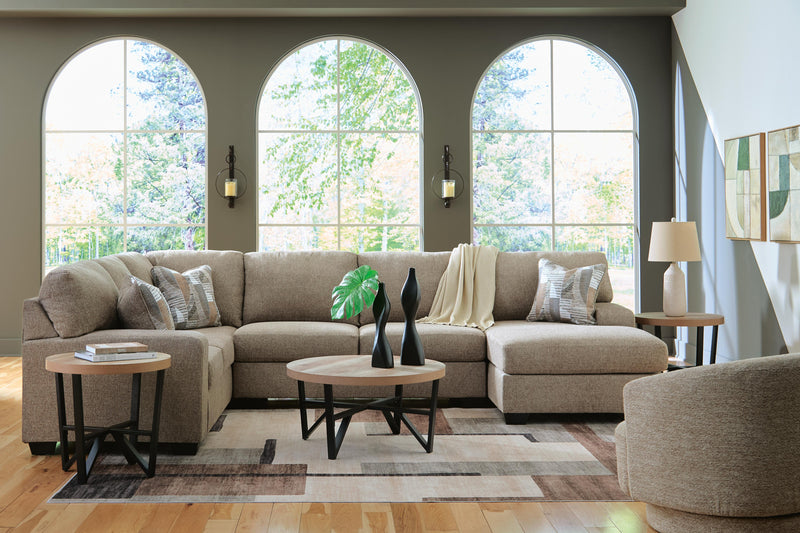 Ashley Furniture Newellen sectional with chaise showing plush fabric upholstery and modern design in a cozy living room setting.