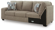 Ashley Furniture Newellen sleeper sectional with chaise, showing plush fabric and modern design in a stylish living room setting.