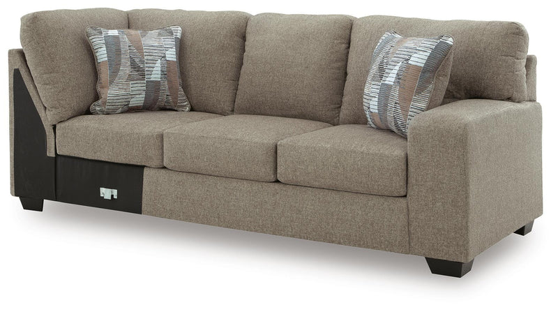 Ashley Furniture Newellen Sleeper Sectional with Chaise, angled view showing plush fabric and modern design.