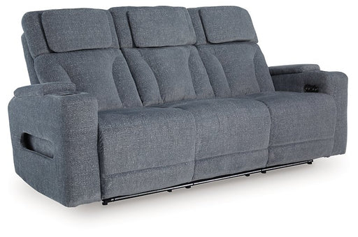 Ashley Furniture Studio Cave power reclining sofa shown from an angle, featuring plush cushions and reclining mechanism.