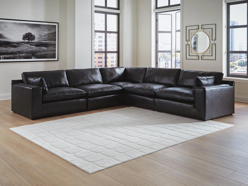 Ashley Furniture Emilia sectional sofa in a neutral fabric upholstery, three-quarter view