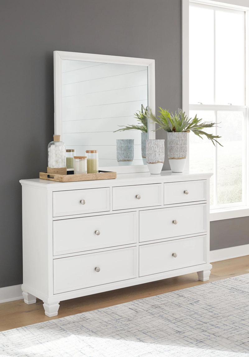 Ashley Furniture Fortman bedroom set with coordinated bed, dresser, mirror, and nightstand furniture.