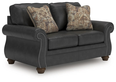 Ashley Furniture Chasemore loveseat in a cozy fabric with plush cushions, shown from an angled view.