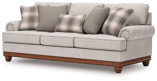 Ashley Furniture Clearbrooke sofa shown from an angled view, highlighting its plush cushions and stylish design.