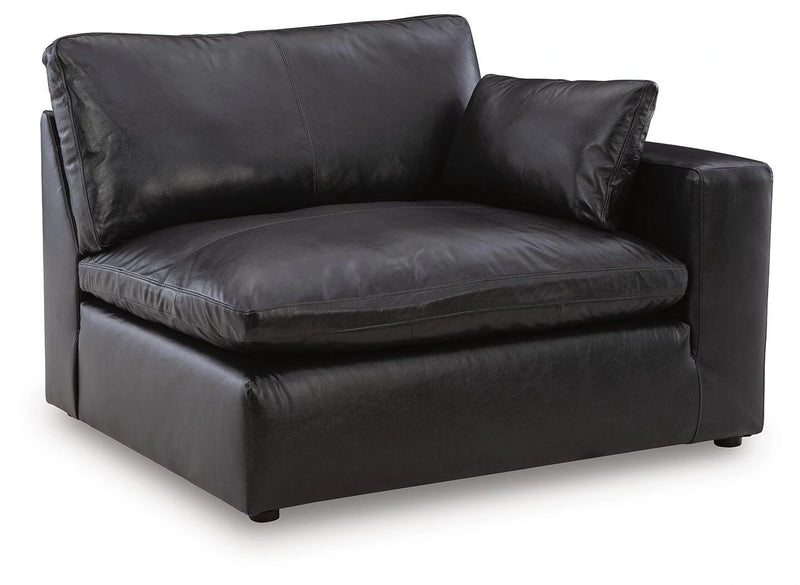 Ashley Furniture Emilia sectional sofa in a neutral fabric with spacious seating and chaise lounge
