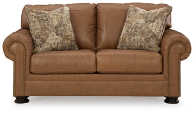 Ashley Furniture Carianna loveseat with plush fabric and cushioned armrests, shown in a front head-on view.