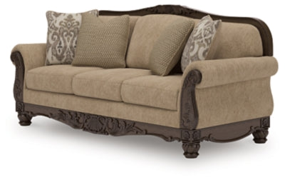 Ashley Furniture Chelsworth Sofa in a stylish fabric with plush cushions, shown from an angled view.