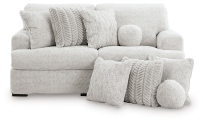 Ashley Furniture Cuddle Plush sectional sofa with soft cushions and plush upholstery, shown in a cozy living room setting.