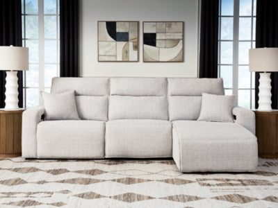 Ashley Furniture Modmax II reclining sectional sofa with chaise, featuring plush cushions and a modern design.