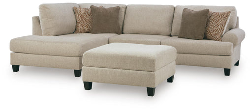 Ashley Steelwater Retreat living room set with sofa and armchair in a modern, stylish design featuring neutral upholstery and wooden accents.