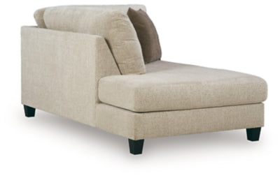 Ashley Furniture Steelwater Retreat sectional with chaise, showing plush cushions and modern design from an angled view.